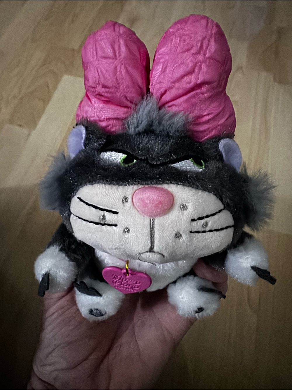 Plush Lucifer Toy with Pink Bow and Heart Tag.